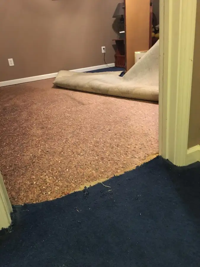 Carpet pad removal revealing water damage during Drying & Dehumidification in Lake of the Pines